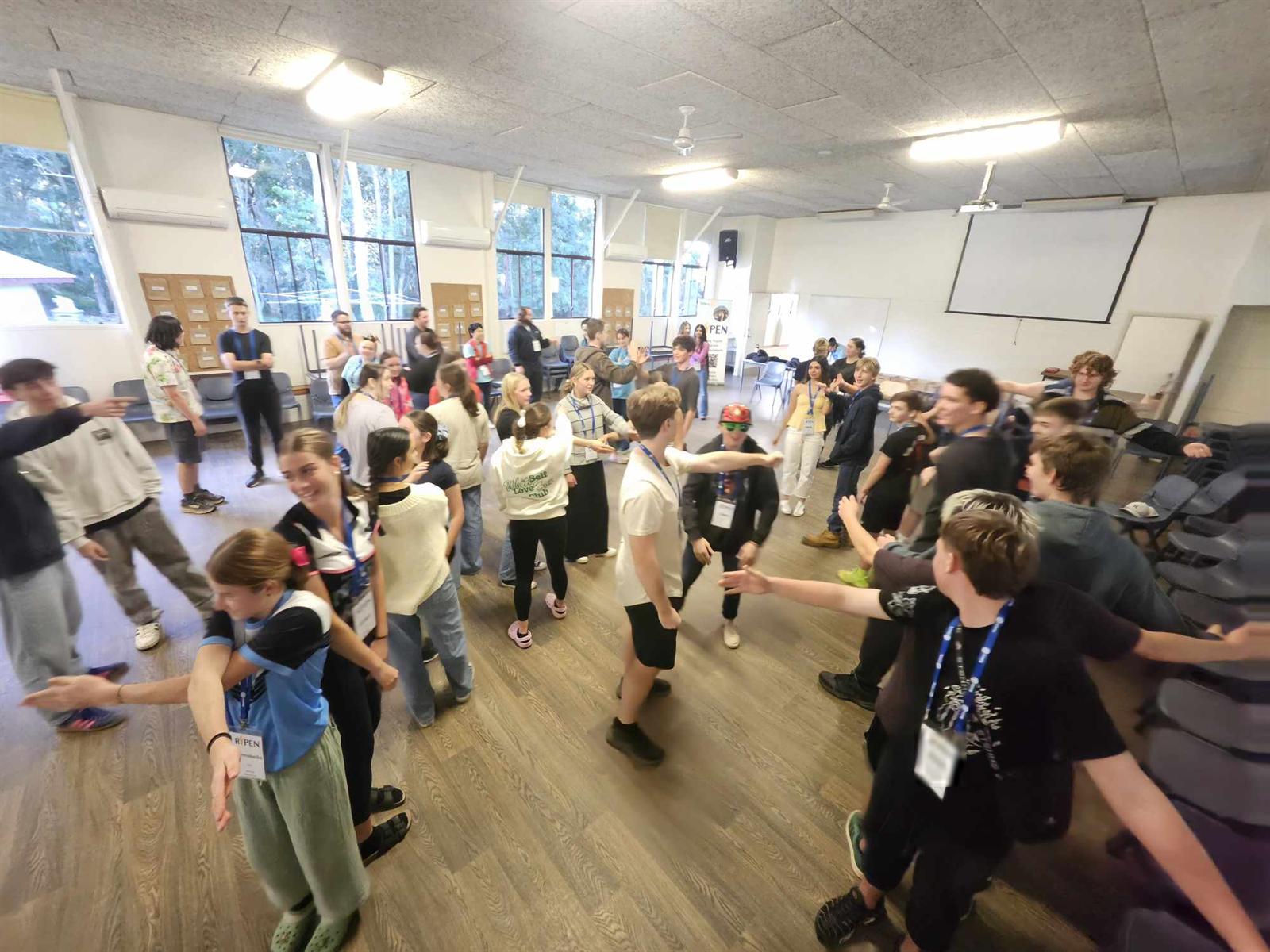 A hall full of RYPEN participants mid-activity
