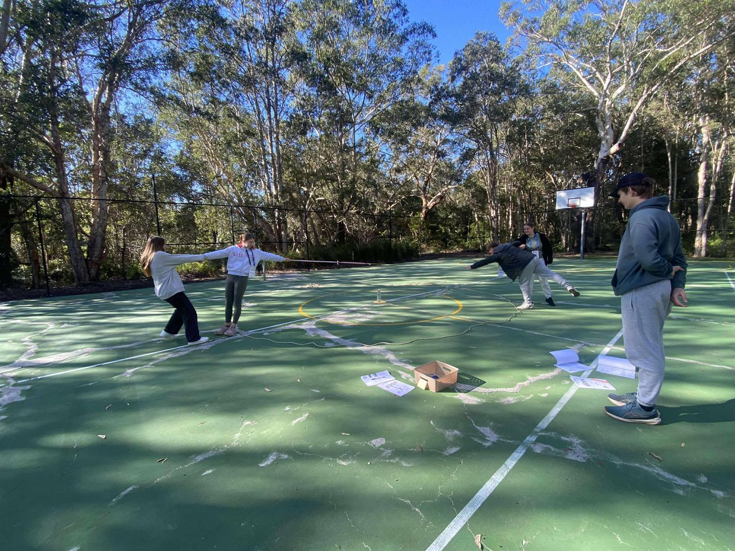 A wide team game running across the outdoor court