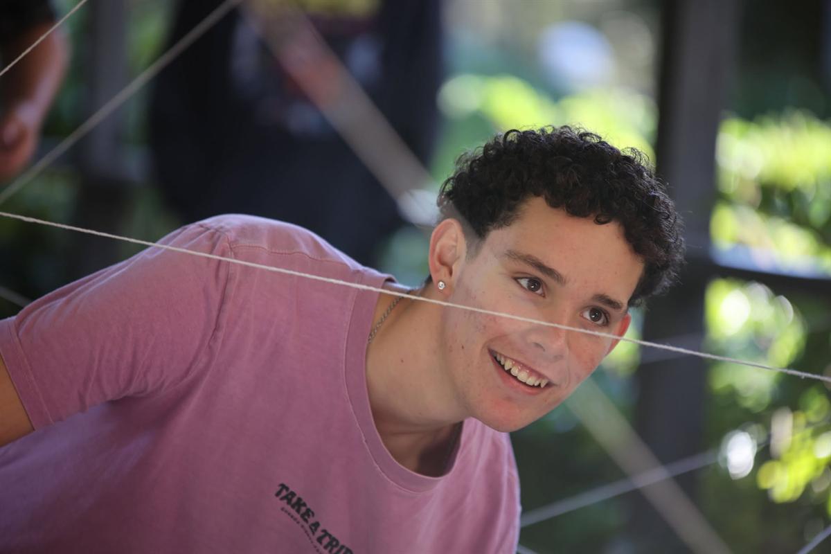 A participant working his way through a string web challenge