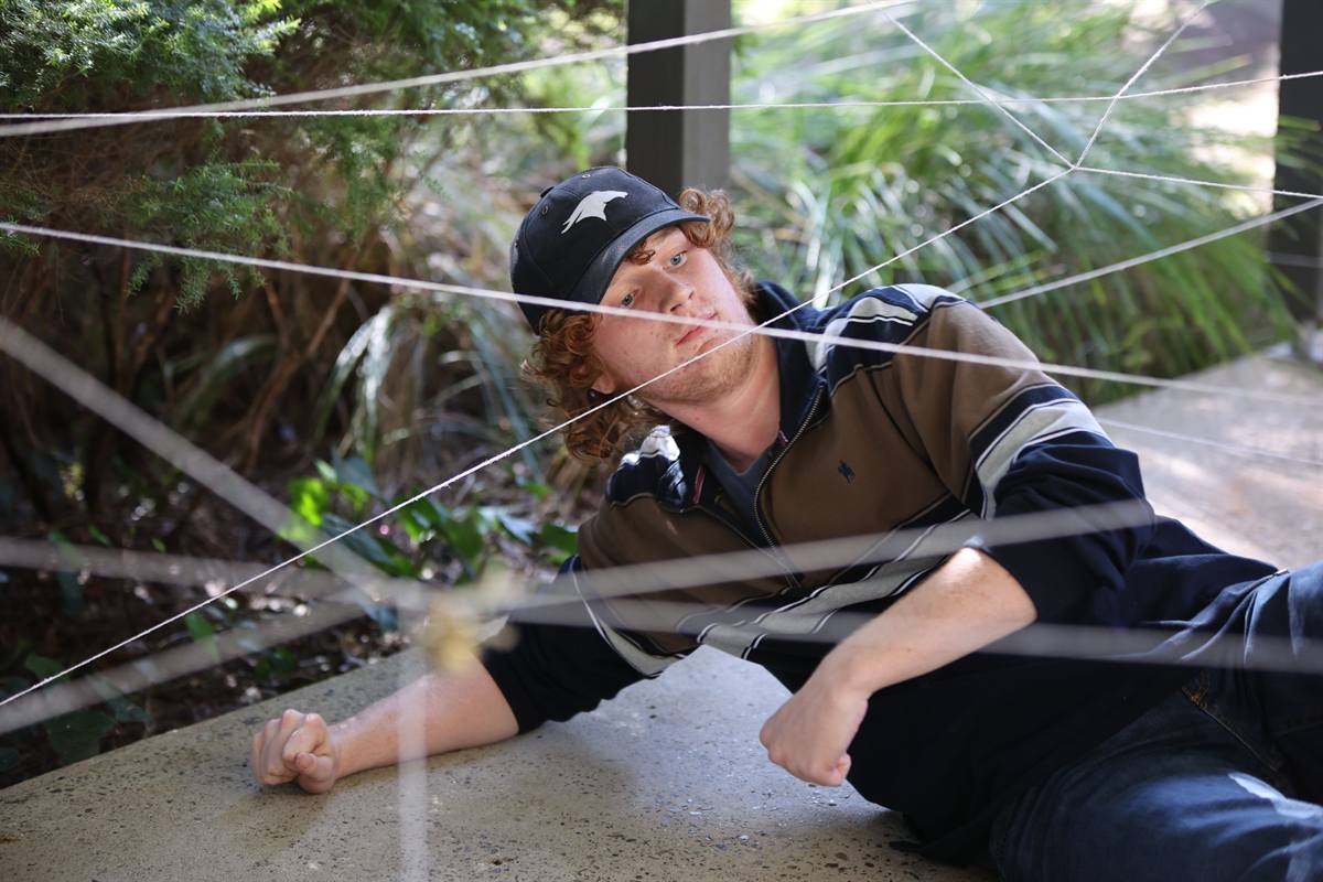 A participant working through a rope challenge