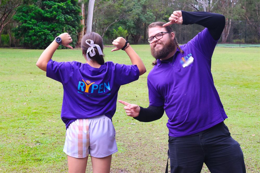A participant and leader celebrating during a camp activity
